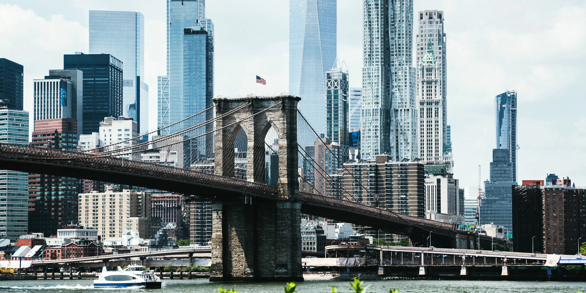 Brooklyn Bridge and One World Trade Center in daylight